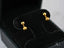 Matte gold drop earrings featuring 18k gold ball design in jewelry box