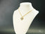 Golden Elegance 18k solid gold necklace with heart-shaped pendant and sparkling gemstones