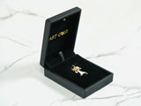 Open 18k solid gold doll charm in black jewelry box