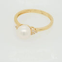 Golden Elegance: Stunning 7mm pearl ring with diamonds