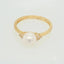 Lustrous 7mm pearl ring with diamond accents showcasing elegance redefined in Golden Elegance