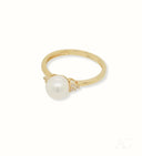 Golden Elegance: Stunning 7mm pearl ring with diamond accents