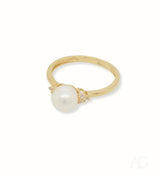 Golden Elegance: Stunning 7mm pearl ring with diamond accents