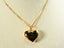 Polished golden heart pendant from Golden Embrace art gold jewelry on delicate chain