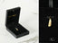 Golden flip flop pendant charms, one in jewelry box and one hanging, part of art gold jewelry