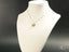 Gold butterfly pendant on delicate chain from Golden Flutter art gold jewelry collection