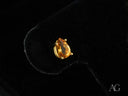 Pear-cut 18k gold citrine gemstone in four-prong gold setting for Golden Glow Citrine Studs