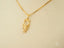 Golden Grace 18k solid gold jewelry featuring a girl-shaped pendant, elegant art gold jewelry