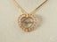 Golden Grace Jesus Pendant featuring art gold jewelry with heart-shaped design and clear gemstones