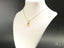 Golden Grace art gold jewelry featuring a teddy bear pendant, a meaningful gift