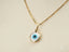 Gold chain necklace with a round evil eye pendant from Golden Guardian art gold jewelry