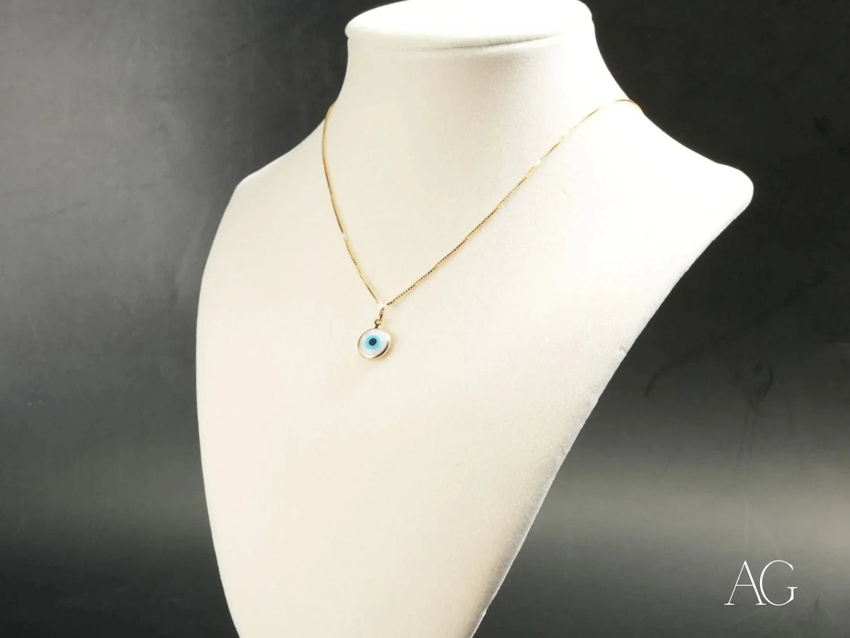 Golden Guardian evil eye pendant in gold chain necklace