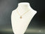 Golden H Doll gold doll pendant featuring delicate art gold jewelry with sparkling heart-shaped pendant