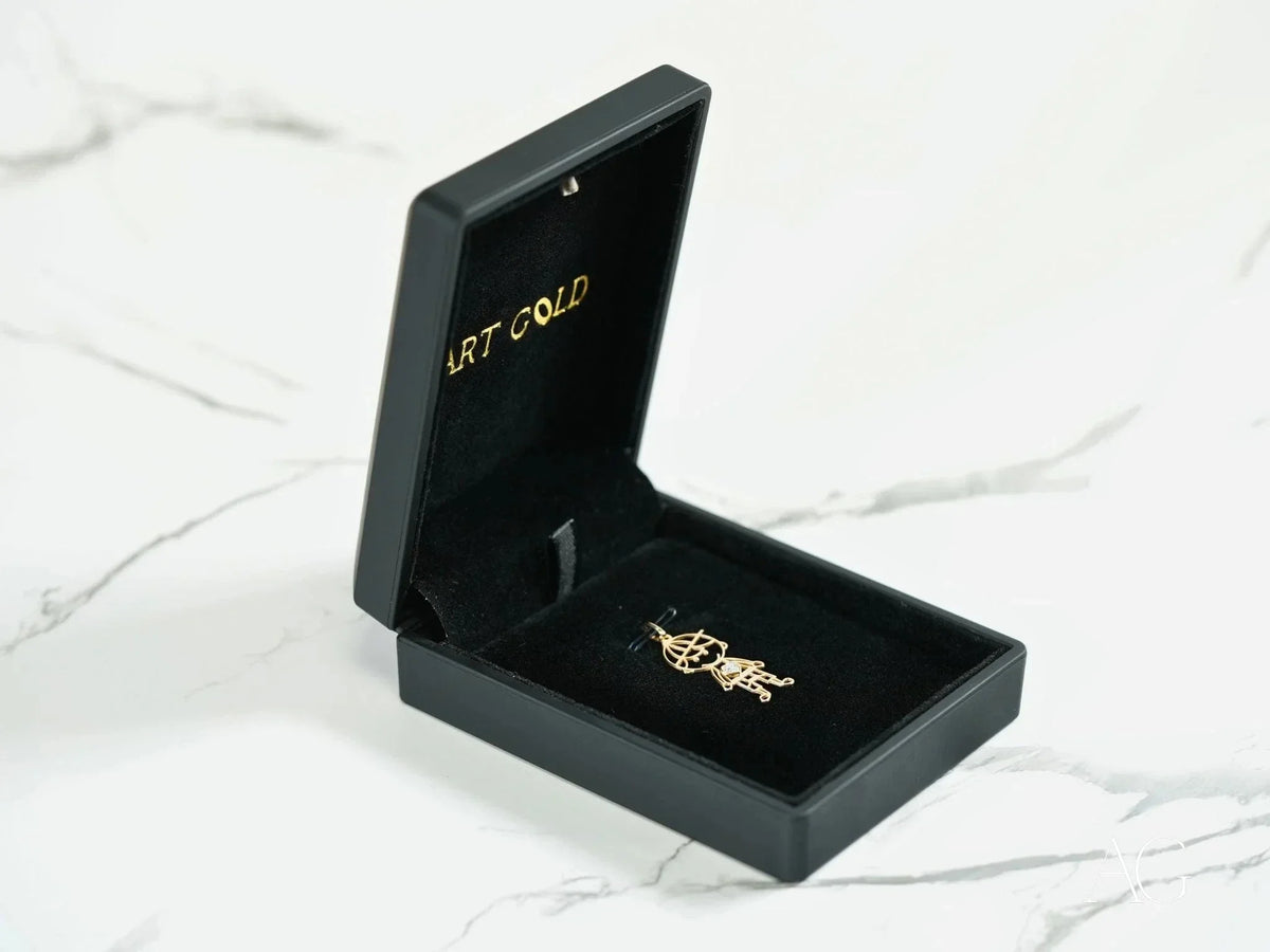 Open black jewelry box with 18k solid gold CZ heart boy pendant