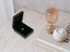 Open black jewelry box with shiny 18k solid gold art gold jewelry Golden Heart Pendant