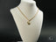 Gold heart pendant necklace on jewelry display showcasing art gold jewelry in 18k solid gold