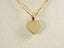 Plain polished 18k solid gold heart pendant on delicate gold chain, ideal for art gold jewelry