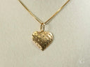 18k solid gold heart pendant with textured lines and star cutouts