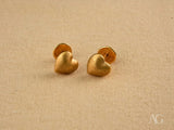 Matte gold heart-shaped stud earrings in 18k gold heart design
