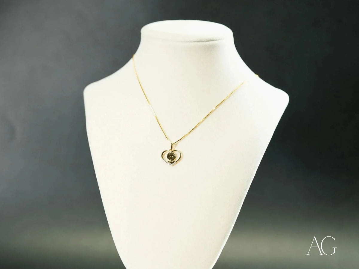 Golden Love pendant: 18k gold heart with green gemstone on chain