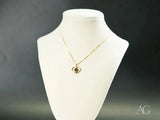 Golden Love pendant: 18k gold heart with green gemstone on chain