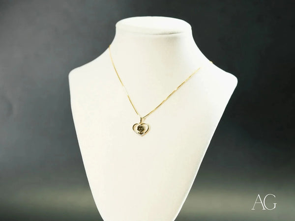 Golden Love pendant: 18k gold heart with green gemstone on chain