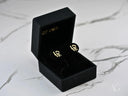 Radiant 18k gold LOVE stud earrings in black velvet box