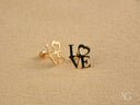 Pair of radiant 18k gold LOVE themed stud earrings