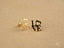 Radiant 18k gold love earrings featuring black accents, part of Art Gold Jewelry collection