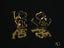 Radiant 18k gold love earrings featuring heart-shaped Os in art gold jewelry design