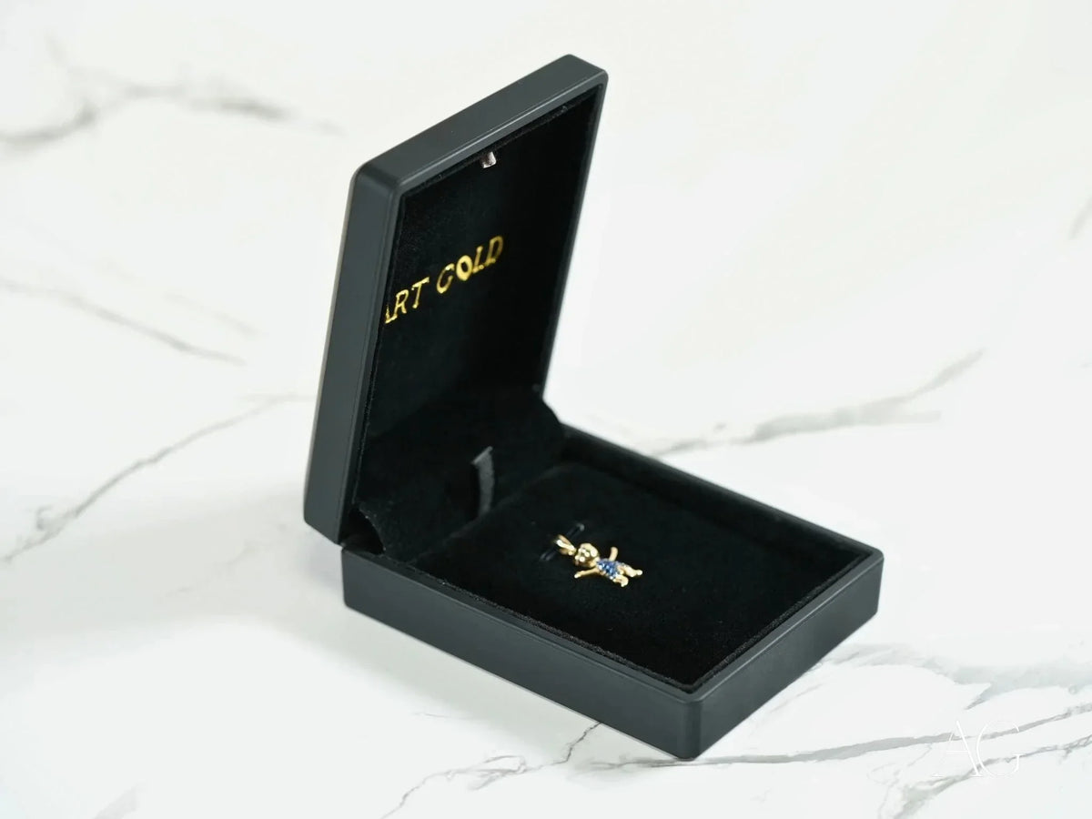 Open black jewelry box with 18k solid gold love pendant charm