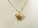 Shiny 18k solid gold heart pendant with diamond-cut texture on chain