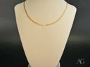 Golden Luxe Cuban 18k gold chain on cream bust
