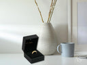 Golden Mesh Elegance ring with intricate design in open black box