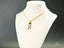Golden Moments art gold jewelry featuring a girl dancing pendant with soccer player charm