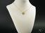 Golden Paws pet lovers pendant featuring art gold jewelry with a gold heart and diamond accent