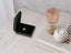 Black velvet jewelry box with a small gold heart charm for Golden Paws pet lovers pendant