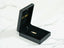 Open black jewelry box with 18k solid gold Golden Play pendant, showcasing art gold jewelry
