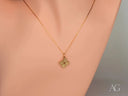 Golden puzzle pendant necklace with four-leaf clover design