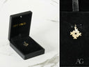 Golden puzzle piece charm with heart cutout for autism awareness