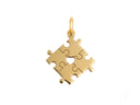 Golden puzzle piece charm with heart cutout for autism awareness