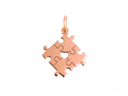 Rose gold golden puzzle piece pendant with heart cutout for autism awareness