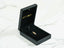 Black velvet jewelry box with colorful gemstone pendant from Golden Ruby Doll art gold jewelry collection