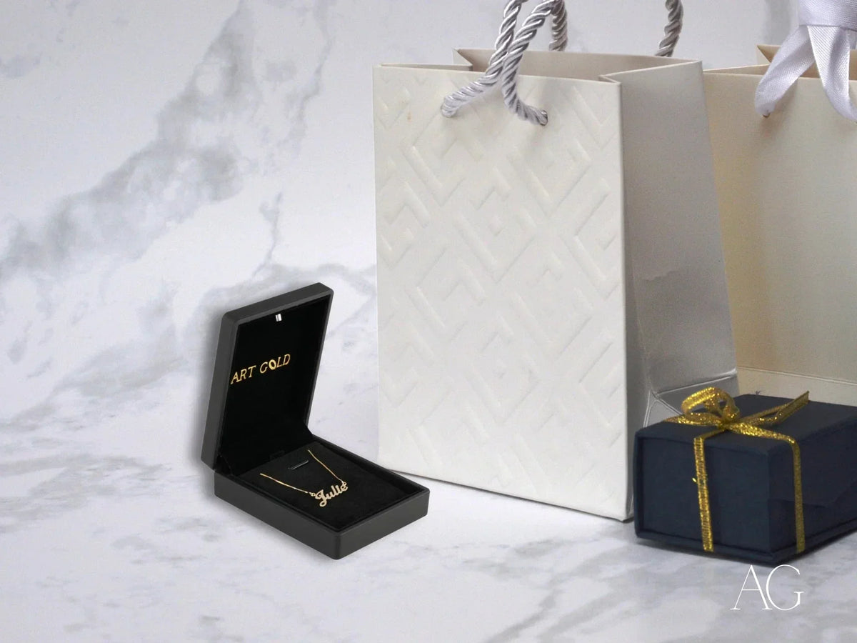 Open black jewelry box with golden signature necklace Julia in solid gold with spring ring lock