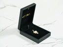 Open black jewelry box with 18k solid gold Golden Son Pendant