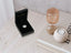 Silver heart-shaped pendant in black jewelry box, part of Golden Spark Heart Pendant collection