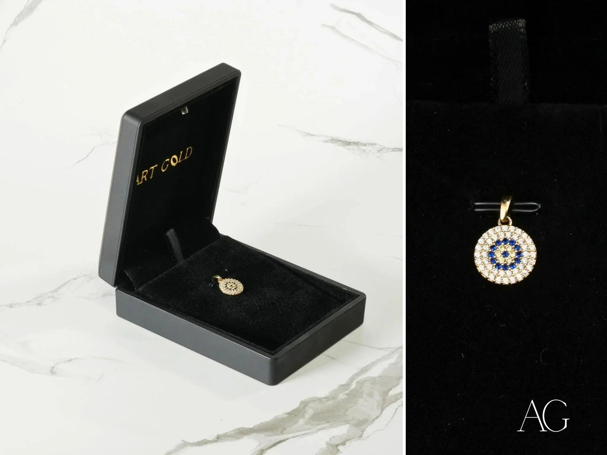 Golden Spark Pendant: 18k solid gold evil eye charm with blue and white stones in black box