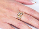 Golden Spectrum 18k 3-tone ring with gold and diamond patterns on finger