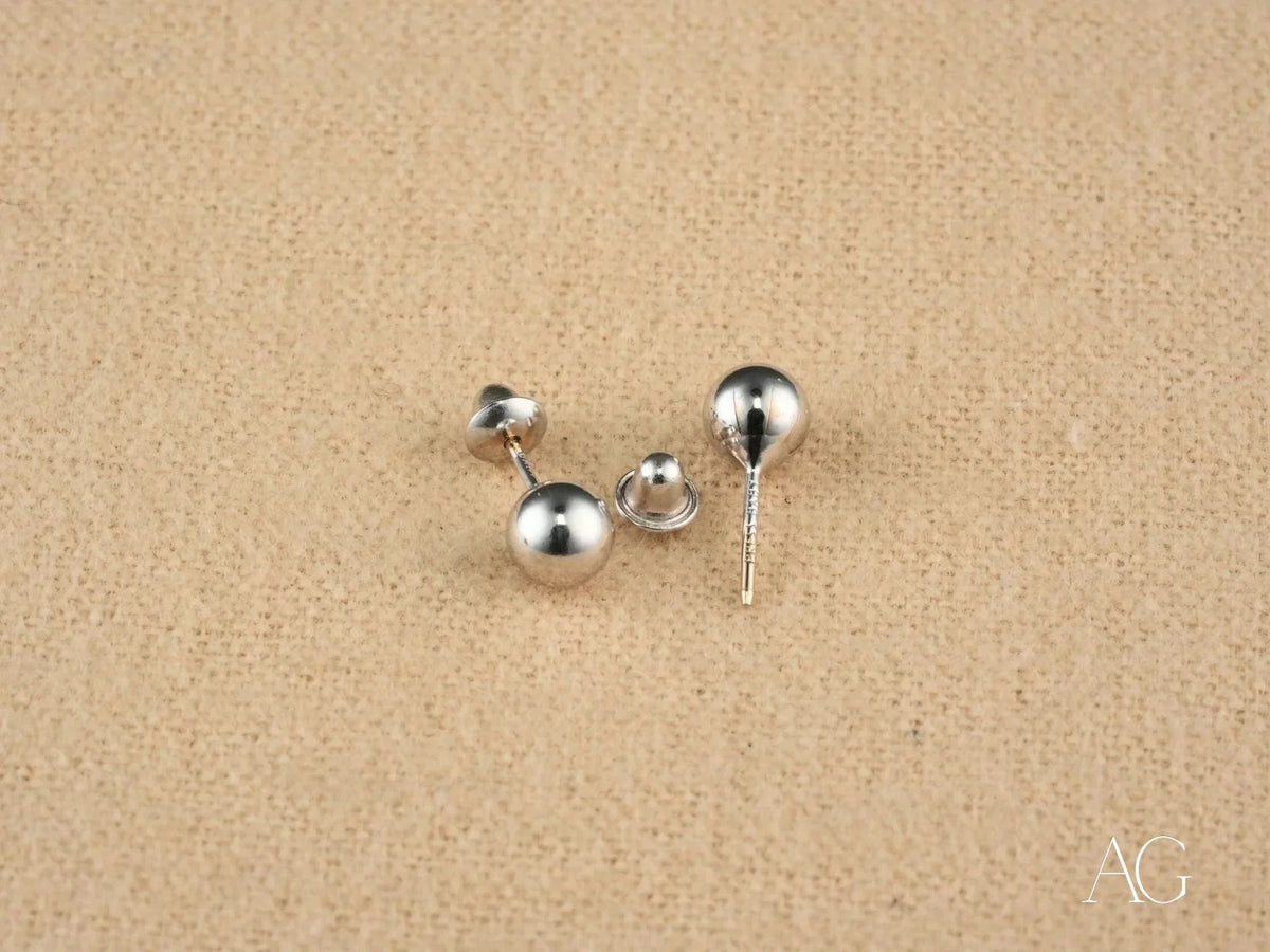 Three 18k white gold 5mm ball earrings with screw-back and post-back closures