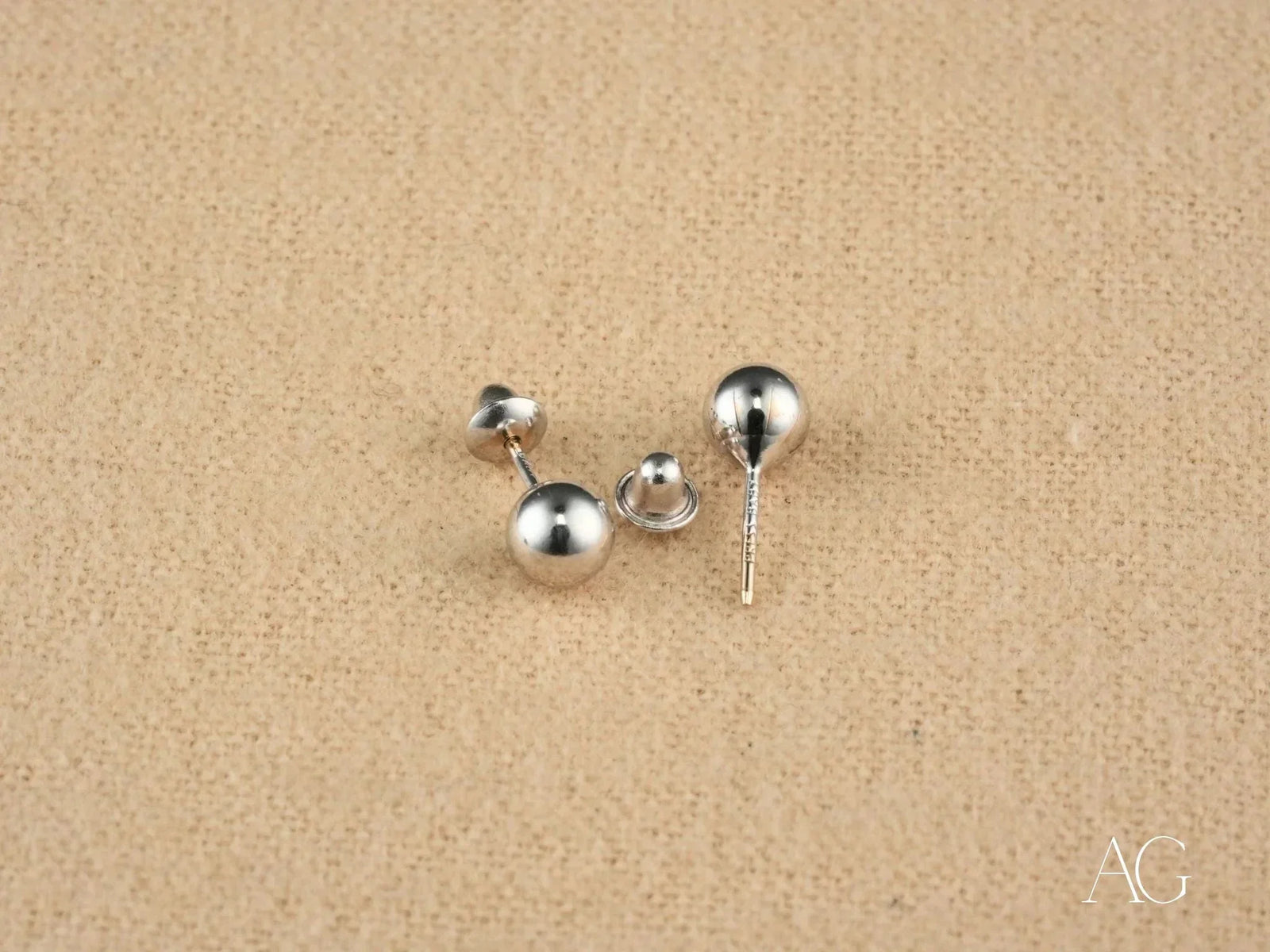 Three 18k white gold 5mm ball earrings with screw-back and post-back closures